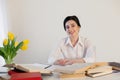 Teacher business Lady reads books in the Office