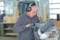 Teacher in carpentry class using circular saw Royalty Free Stock Photo
