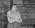 Teacher with Chalkboard, Cursive Handwriting Royalty Free Stock Photo