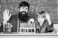 Teacher and child test tubes. Perseverance pays off. Chemical experiment. Symptoms of ADHD at school. Schoolboy cute Royalty Free Stock Photo