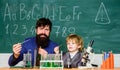 Teacher child test tubes. School lesson. Chemical experiment. Difficult focus and complete school tasks. Perseverance Royalty Free Stock Photo