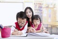 Teacher and children study in classroom Royalty Free Stock Photo