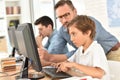 Teacher with children using computer Royalty Free Stock Photo