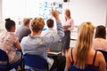 Teacher With College Students Giving Lesson In Classroom Royalty Free Stock Photo