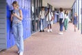 Teacher Confronting Students Teasing Or Bullying Unhappy Teenage Girl Outdoors At High School Royalty Free Stock Photo