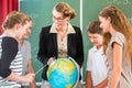 Teacher educate students having geography lessons in school Royalty Free Stock Photo