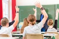 Teacher educate or teaching a class of pupils in school Royalty Free Stock Photo