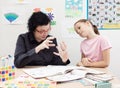Teacher explains lesson to child in gesture