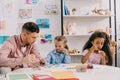 teacher in eyeglasses and multiracial children Royalty Free Stock Photo