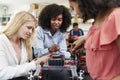 Teacher With Female Pupils Building Robotic Vehicle In Science Lesson Royalty Free Stock Photo