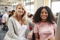 Teacher And Female Student Work On Computer In College Library Royalty Free Stock Photo