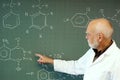 Teacher in front of his class at the blackboard Royalty Free Stock Photo