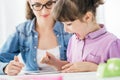 Teacher and girl using a digital tablet Royalty Free Stock Photo