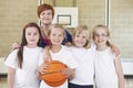 Teacher With Girls School Basketball Team