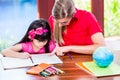 Teacher giving language lessons to Chinese child Royalty Free Stock Photo