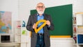 Teacher going to continue embracing new roles and responsibilities. Senior man teacher at chalkboard. Back to school Royalty Free Stock Photo