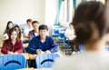 Teacher with group of college students in classroom Royalty Free Stock Photo