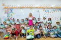 Teacher with a group of first graders children on the last day of school