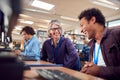 Teacher With Group Of Mature Adult Students In Class Working At Computers In College Library Royalty Free Stock Photo