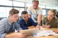 Teacher with group of students on digital tablet Royalty Free Stock Photo