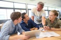 Teacher with group of students at school Royalty Free Stock Photo