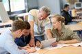 Teacher with group of students on tablet Royalty Free Stock Photo