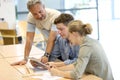 Teacher with group of students on tablet Royalty Free Stock Photo