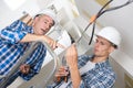 Teacher guiding electrical apprentice