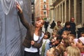 Teacher guiding her pupils in a field trip