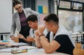 Teacher guiding students during collaborative classroom learning session Royalty Free Stock Photo