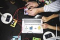 Teacher hands turning on solar windmill energy produce switch in