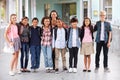 Teacher hanging out with group of elementary kids at school