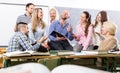 Teacher and happy adult students Royalty Free Stock Photo