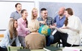 Teacher and happy adult students Royalty Free Stock Photo