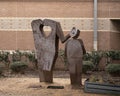 `Teacher With Heart`, a metal sculpture by John Dennard located at Dowell Middle School in McKinney, Texas. Royalty Free Stock Photo