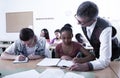 Teacher helping African-American schoolgirl Royalty Free Stock Photo