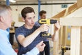 Teacher Helping College Student Studying Carpentry Royalty Free Stock Photo