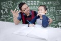Teacher helping his student to count Royalty Free Stock Photo