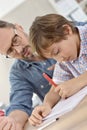 Teacher helping pupil with lesson Royalty Free Stock Photo