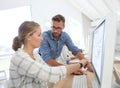 Teacher helping student girl working on computer Royalty Free Stock Photo