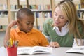 Teacher helping student with reading skills Royalty Free Stock Photo
