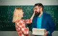 Teacher helping young student with lesson. Nerd funny student preparing for university exams. Concept of education and Royalty Free Stock Photo