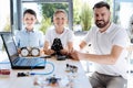 Teacher and his students posing during robotics workshop Royalty Free Stock Photo