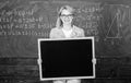 Teacher hold blackboard blank advertisement copy space. Information for incoming exchange students. Teacher show school