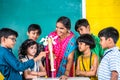 Teacher with human spine biological model explaining to students during anatomy class at school - conept of stem Royalty Free Stock Photo