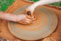 Teacher and kid making ceramic pot. Potters and child hands. Pottery workshop outside Royalty Free Stock Photo