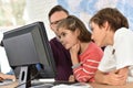 Teacher with kids in front of computer Royalty Free Stock Photo