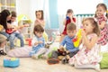 Teacher and cute kids during music lesson in preschool Royalty Free Stock Photo