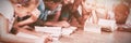 Teacher and kids lying on floor reading book in library Royalty Free Stock Photo