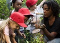 Teacher and kids school learning ecology gardening